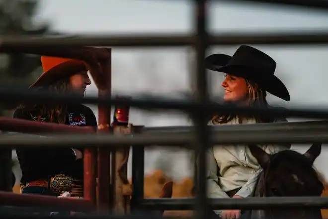 Girls wait for the beginning of the rodeo at the Tuscarawas County Fair.