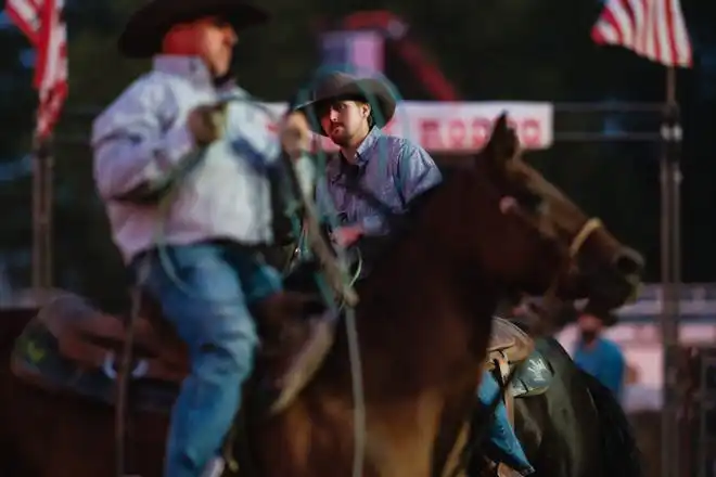 A contestant in team roping during the rodeo at the Tuscarawas County Fair.