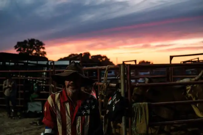 John Phillips, of Newcomerstown, waits for bull riding to begin at the Tuscarawas County Fair.