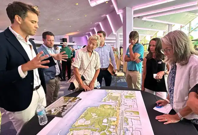 Architect Kerry Joyce talks with attendees during a break-out session. The conceptual design presented by the Renzo Piano Building Workshop includes separate buildings for the lobby, large, medium and small theaters, rather than one large structure. The Sarasota Performing Arts Foundation held a town hall meeting Wednesday, Sept. 18, 2024, to present design concepts of the new performing arts center.