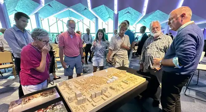 Architect Mark Carroll, with Renzo Piano Building Workshop, talks with attendees looking at a model of a concept for the new performing arts center. The conceptual design presented by the Renzo Piano Building Workshop includes separate buildings for the lobby, large, medium and small theaters, rather than one large structure. The Sarasota Performing Arts Foundation held a town hall meeting Wednesday, Sept. 18, 2024, to present design concepts of the new performing arts center.