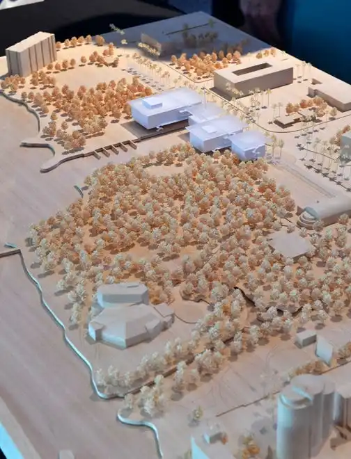 A scale-model of the conceptual design presented by the Renzo Piano Building Workshop includes separate buildings for the lobby, large, medium and small theaters, rather than one large structure. The existing Van Wezel Performing Arts Hall is visible in the foreground. The proposed structures can be seen in the top, center of the frame, near 10th St. and the canal. The Sarasota Performing Arts Foundation held a town hall meeting Wednesday, Sept. 18, 2024, to present design concepts of the new performing arts center.