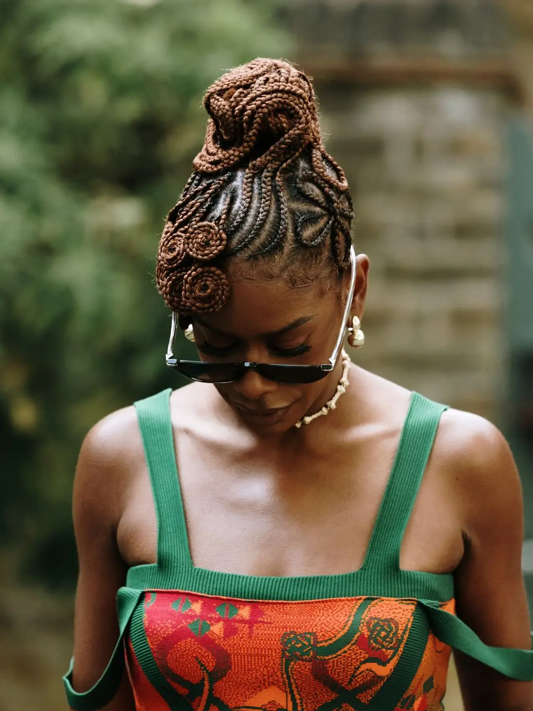 Zeze Mills wears an intricate braided up-do to London Fashion Week 