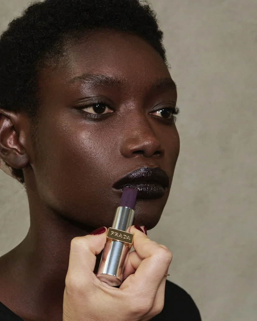 Glossy black cherry lips were spotted at Milan Fashion Week S/S 2025.