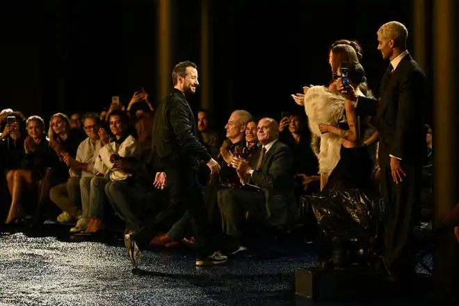 Designer Anthony Vaccarello acknowledges the audience following the Saint Laurent show at PFW.