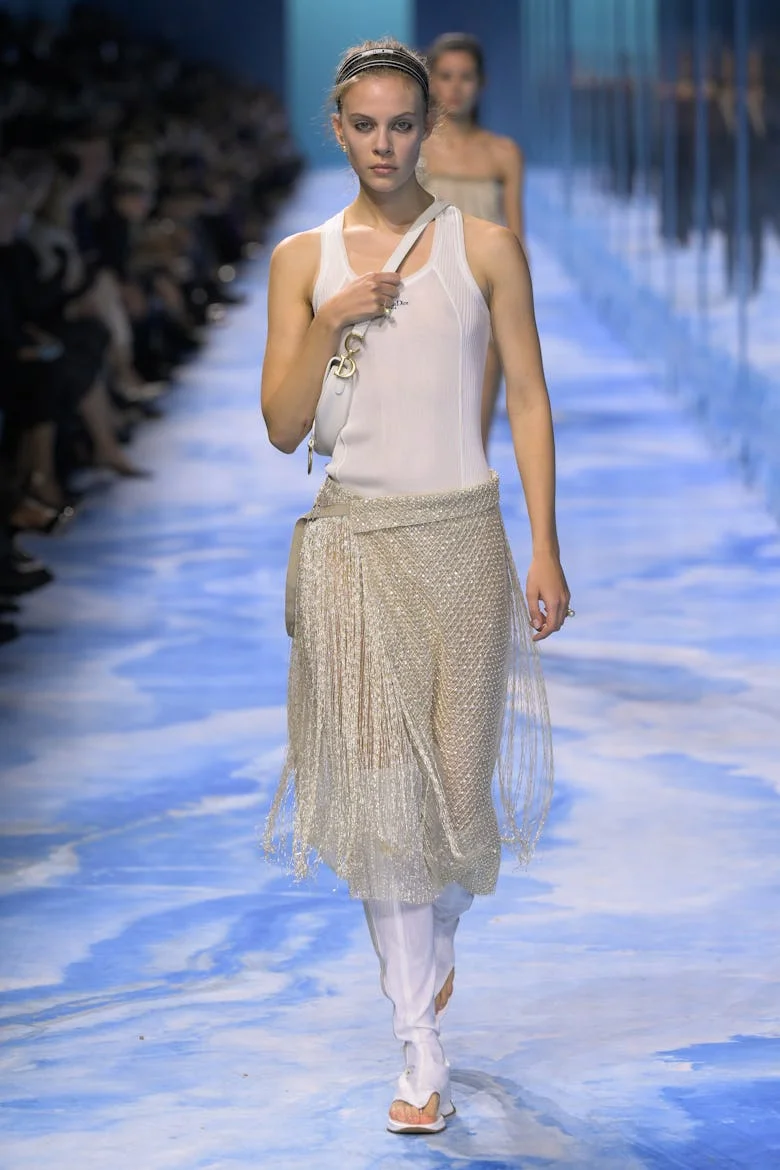 Model on the runway at Christian Dior RTW Spring 2025 as part of Paris Ready to Wear Fashion Week he...