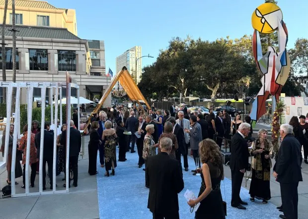 Guests mingle in the Circle of Palms outside the San Jose Museum of Art before the museum's gala and auction on Sept. 21, 2024. (Sal Pizarro/Bay Area News Group)