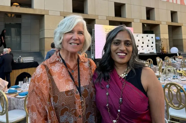 San Jose Museum of Art Executive Director S. Sayre Batton, left, and artist Chitra Ganesh pose in the Circle of Palms at the San Jose Museum of Art Gala and Auction on Sept. 21, 2024. (Sal Pizarro/Bay Area News Group)