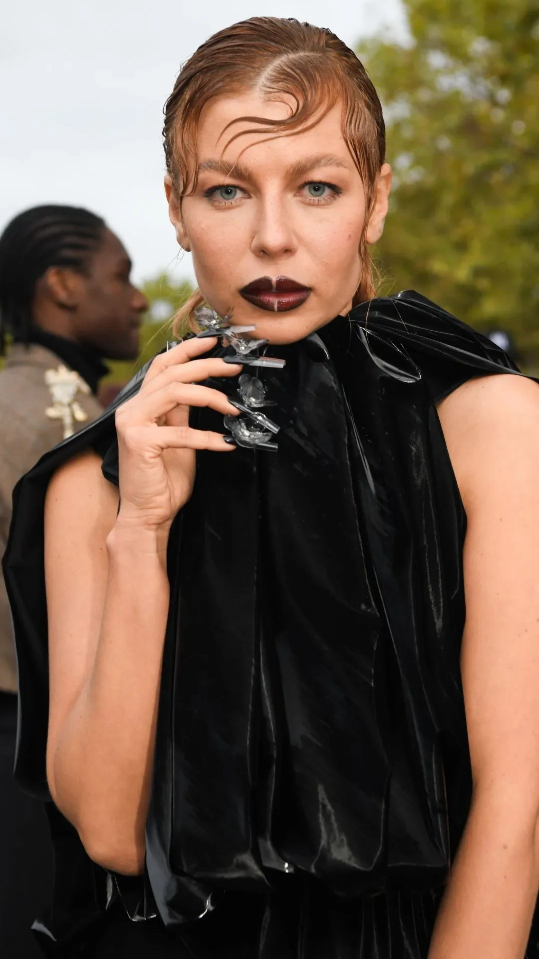 Lina Taut Dembikova is seen wearing a black long dress outside Balenciaga fashion show during Womenswear Spring/Summer 2025 as part of Paris Fashion Week on September 30, 2024 in Paris, France.