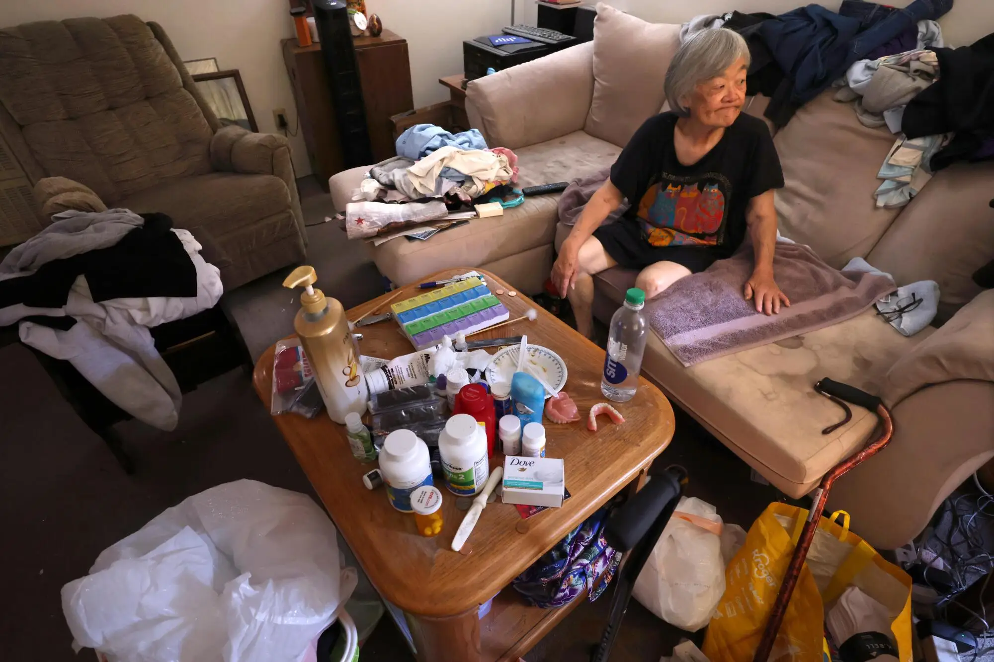 Shirley Nakatsuru sits in her crowded living room