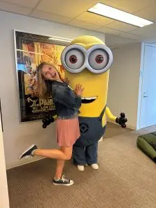 UConn student Emily Laput poses with a person dressed as a Minion.