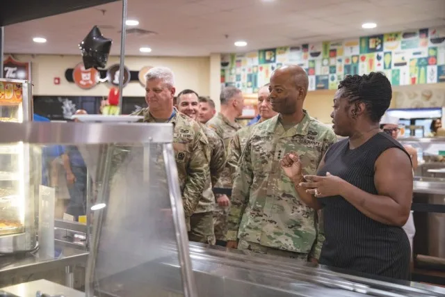 Chontrelle Sturdivant, Food Program Management Office manager, guides Lt. Gen. Kevin D. Admiral, III Armored Corps and Fort Cavazos commander, and Command Sgt. Maj. John P. McDwyer, III Armored Corps and Fort Cavazos command sergeant major,...