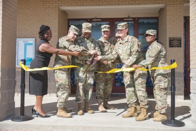 Fort Cavazos and the Fort Cavazos Food Program leadership cut the ribbon at the Headquarters Department of the Army Go for Green Action Station unveiling ceremony Oct. 9 at the Operation Iraqi Freedom Dining Facility at Fort Cavazos. (U.S. Army...