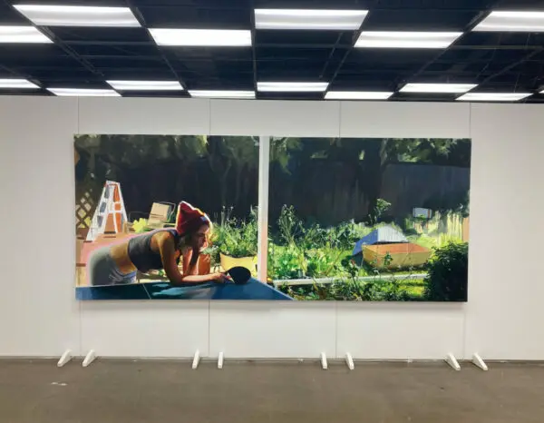 A photograph of a large-scale painting by Ariel Davis. 