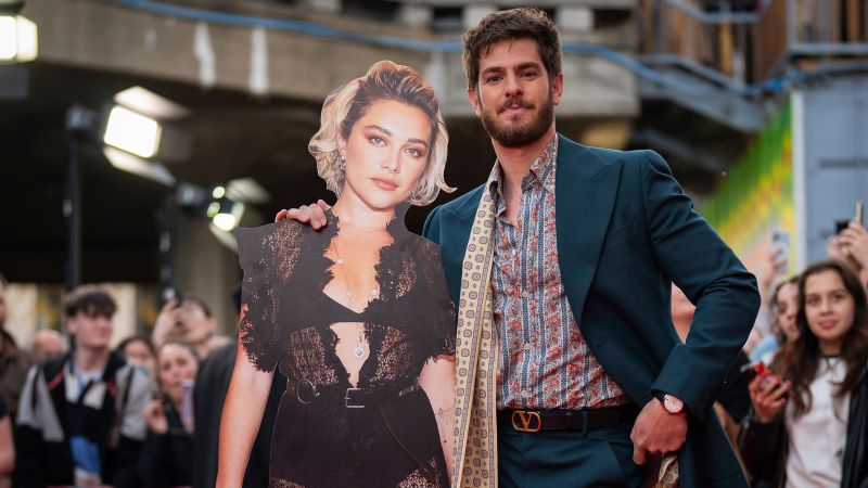 Actor Andrew Garfield brings cardboard cutout of co-star to red carpet