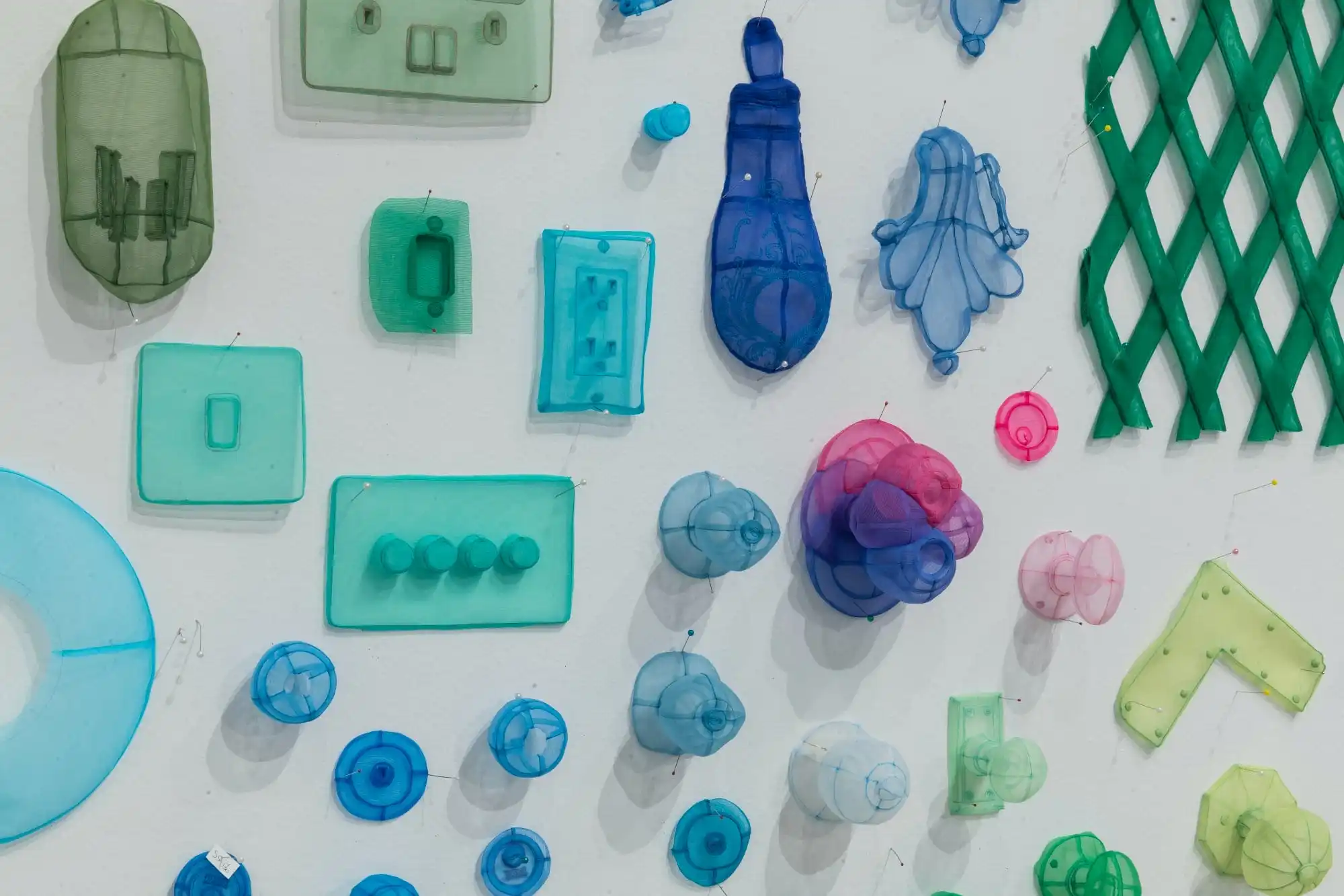 a collection of translucent fabric objects