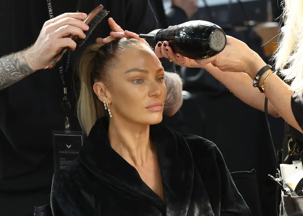 Candice Swanepoel prepares backstage at the Victoria's Secret Fashion Show 2024 on October 15, 2024, in New York City. (Photo by Arturo Holmes/Getty Images for Victoria's Secret)