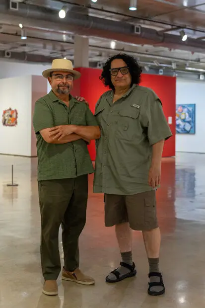 A photograph of artist Rolando Briseño and curator Ruben Cordova.