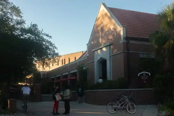 Students stand outside of Seminole Cafe, a dining location on FSU's campus.