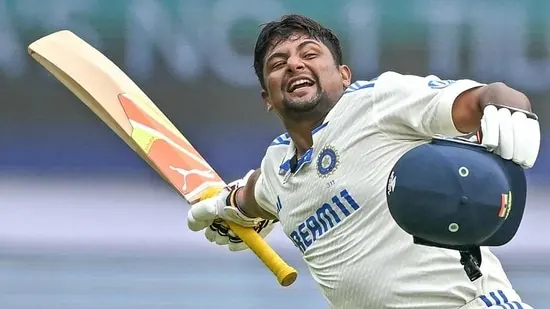 Sarfaraz Khan celebrates after scoring a century against New Zealand in Bengaluru on Saturday.(AFP)