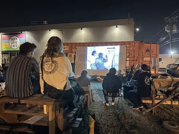 a film screening outside a mobile media unit