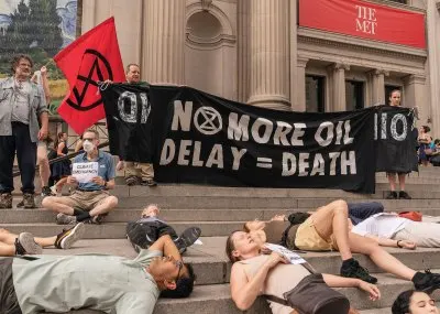 NEW YORK, UNITED STATES - 2023/07/08: Activists from the Extinction Rebellion staged a 'die-in' at a solidarity protest at the Metropolitan Museum of Art in New York to drop charges against Joanna Smith and Tim Martin. Joanna Smith and Tim Martin during an act of civil disobedience at National Gallery of Art in Washington, DC left their handprints on the protective glass of Degas sculpture. (Photo by Lev Radin/Pacific Press/LightRocket via Getty Images)