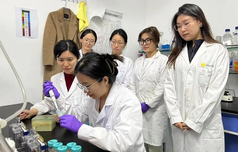 Researchers from the School of Life Sciences of Tianjin University conduct an experiment in a laboratory.