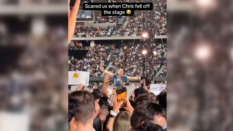 Chris Martin falls into hole on stage during show in Australia