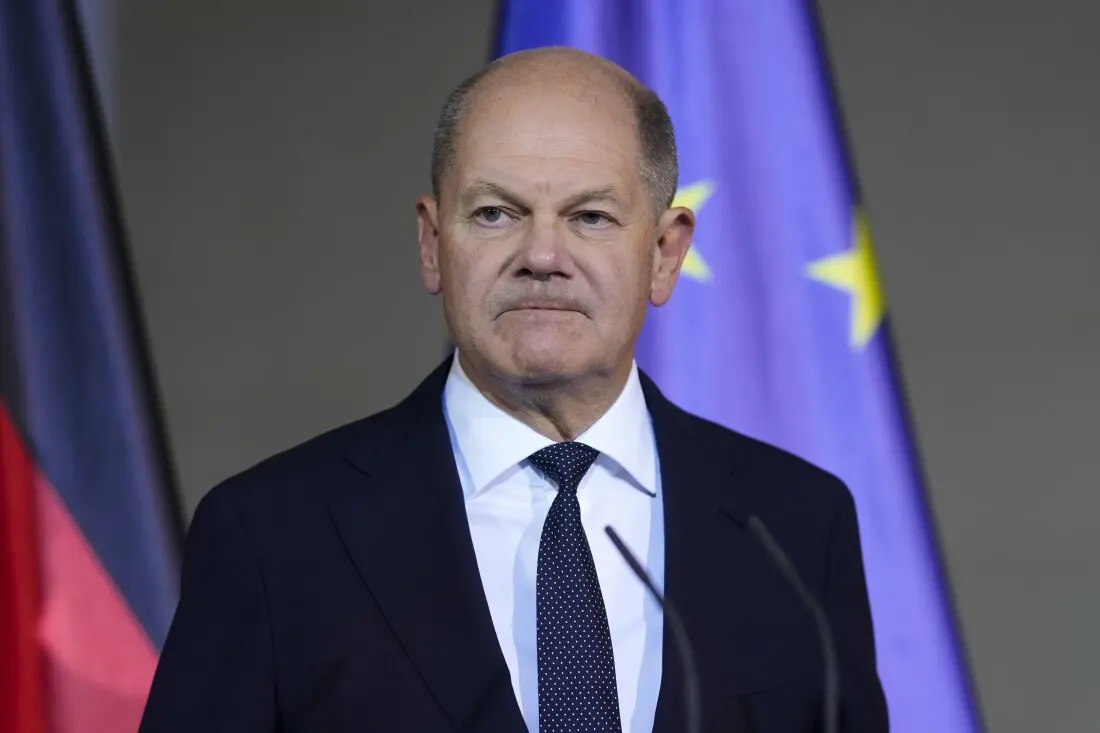 German Chancellor Olaf Scholz gives a statement after a meeting with government leaders in Berlin, Wednesday.