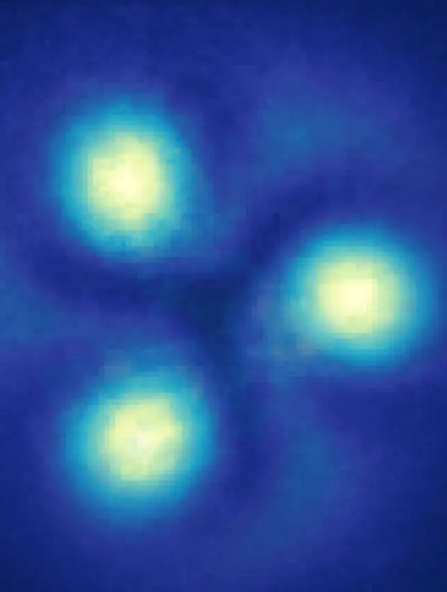 Three yellow glowing blobs on a blue background