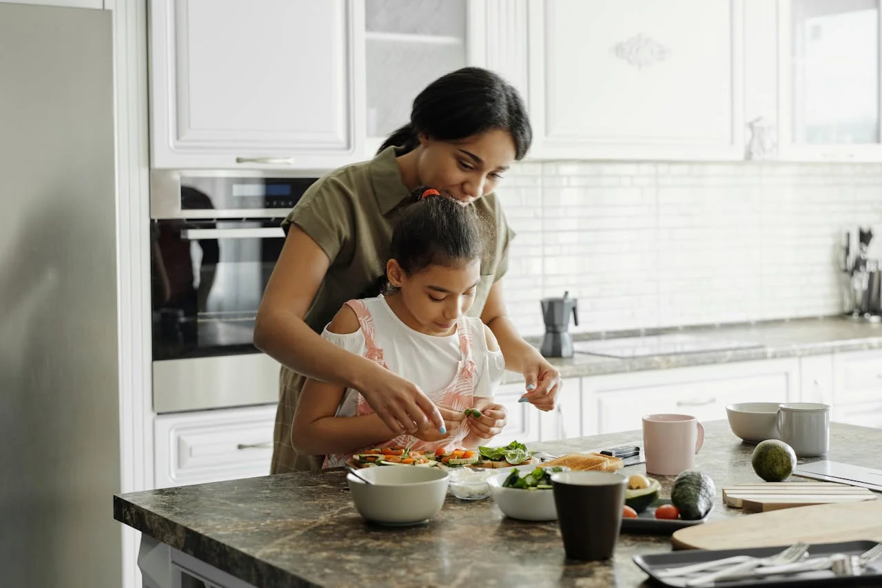 mother and daughter cooking