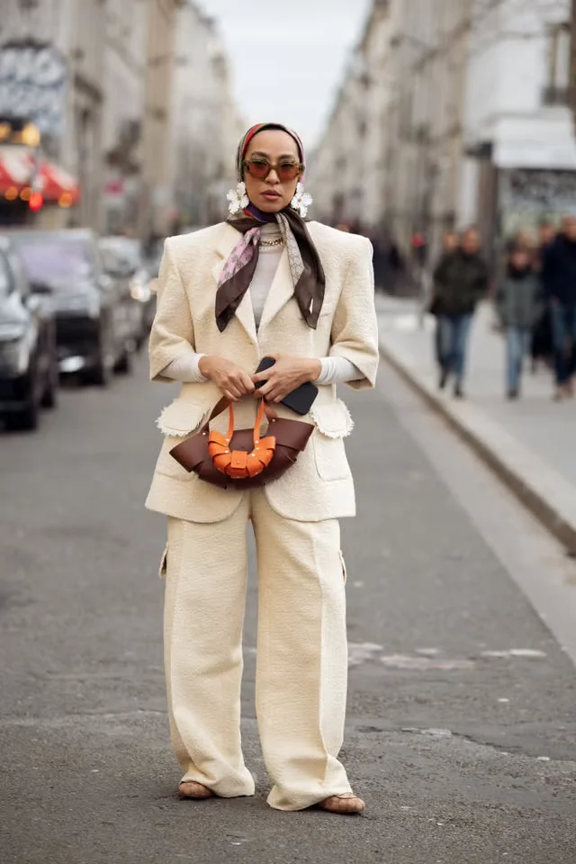 fashionable individual in a street setting donning a stylish outfit