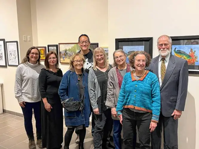 From left, Elisabeth Alba, Beth Roberge, Yoshi Kogo, Sean Wang, Ruth Sanderson, Diane deGroat, Robin Brickman and Dick Walz, members of the Western Massachusetts Illustrators Guild, at the Rhodes Arts Center gallery at Northfield Mount Hermon School in Gill, where their work is on display until Nov. 22.