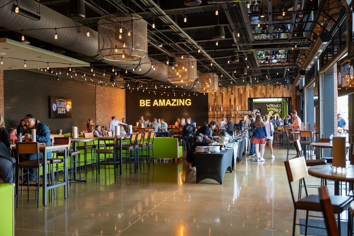 A bar with a buffet at Chicken N Pickle Henderson.