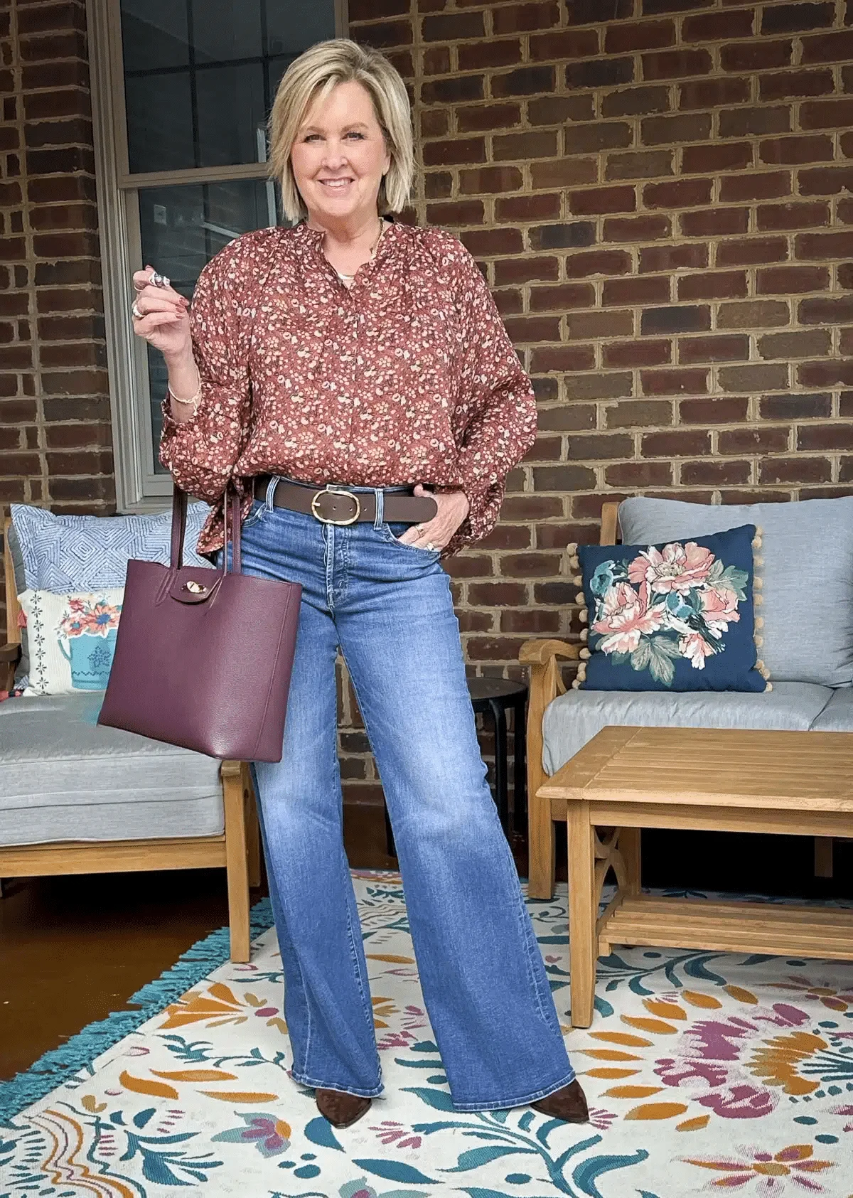 Tania Stephens wearing Mother wide leg jeans and a floral top