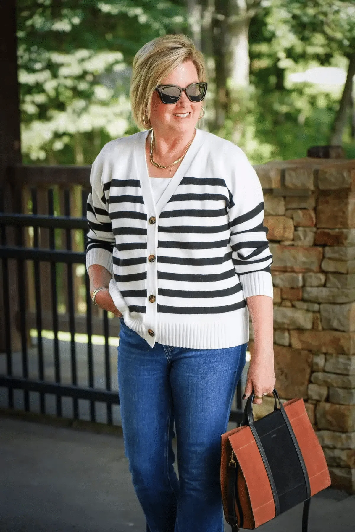 Tania Stephens wearing a white and black striped cardigan