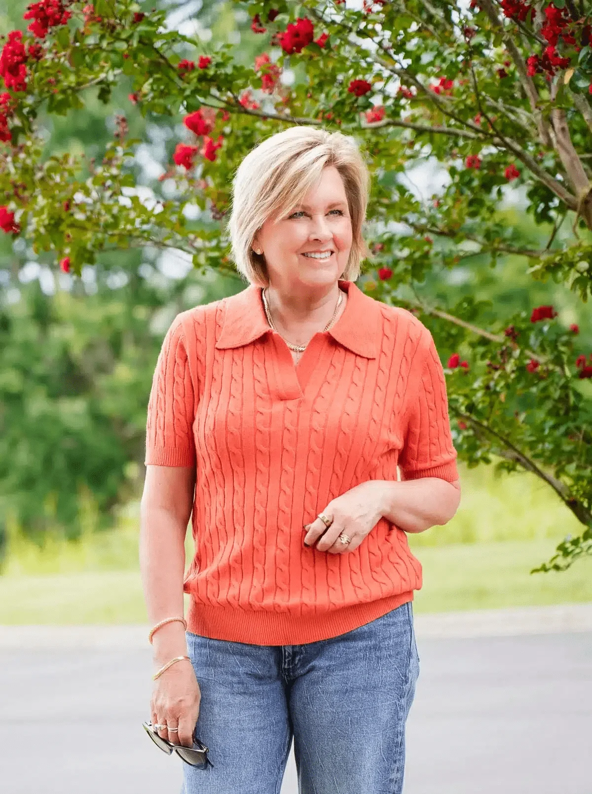 Tania Stephens wearing an orange polo sweater