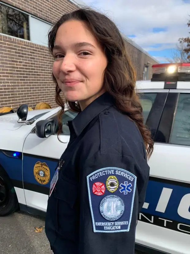 Scranton donated a 2015 Ford Taurus Interceptor police car to the Career Technology Center of Lackawanna County for education in the high school's Protective Services Program. The city delivered the vehicle to the school in Scranton on Friday, Nov. 15, 2014. Madilyn Amorine, a student in the Protective Services Program, was one of several students who attended the event. JIM LOCKWOOD / STAFF PHOTO