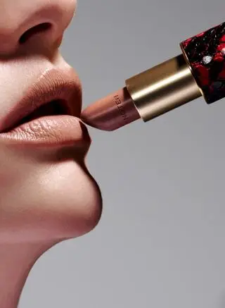 Model applying Dries Van Noten lipstick