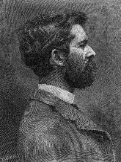 A black-and-white portrait of a bearded man facing to the side.