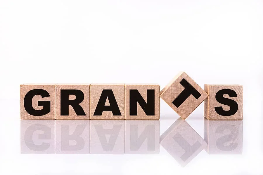 grants-word-text-written-on-wooden-cubes-on-a-white-background