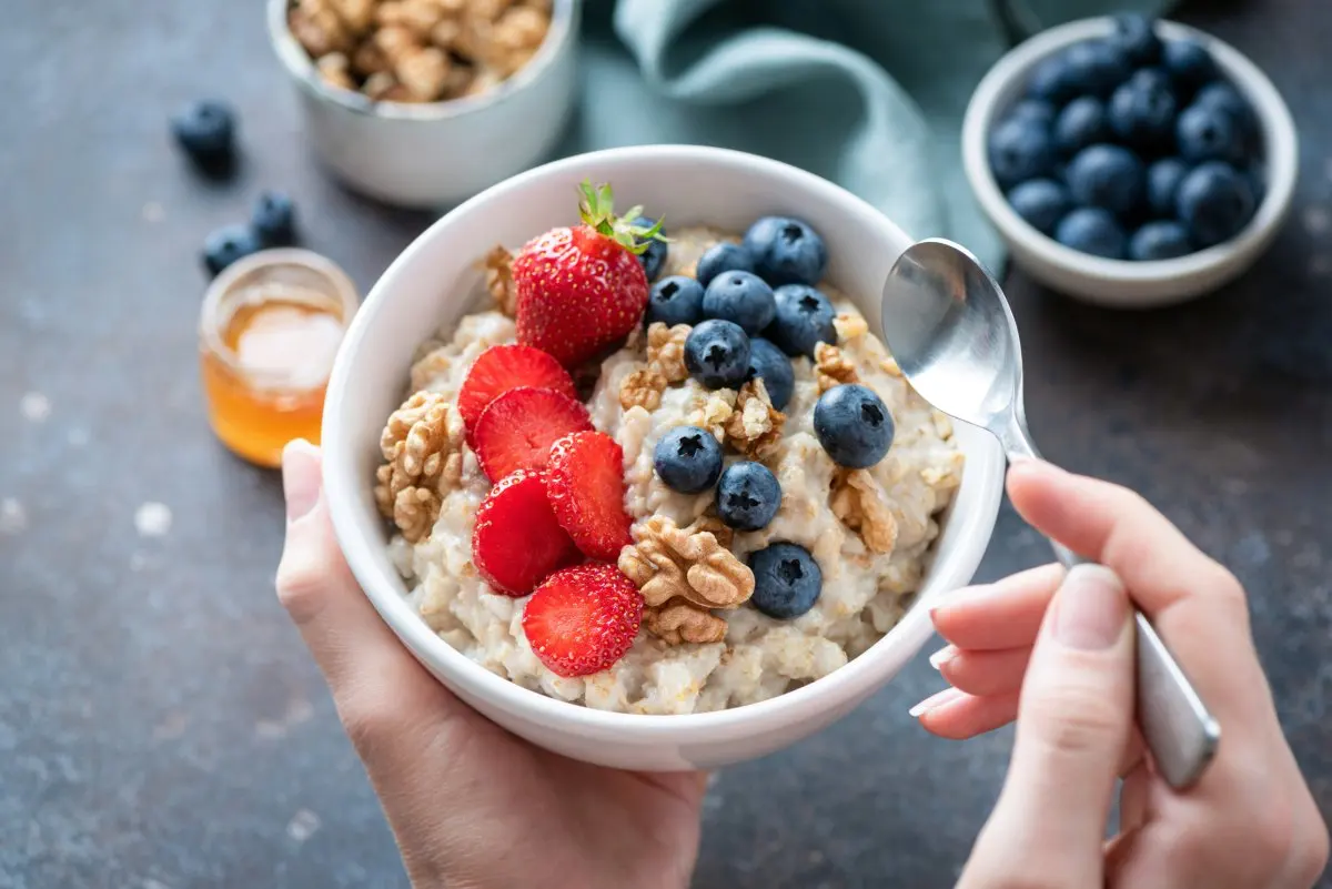 Oatmeal porridge bowl with berry fruits