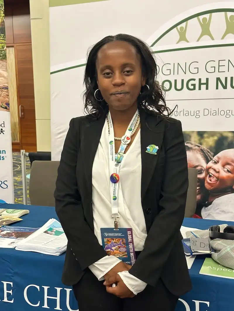 Diana Kibugu, a student from Kenya, visits the Church's information booth at the  World Food Prize Borlaug International Dialogue in Des Moines, Iowa, on Oct. 31, 2024.