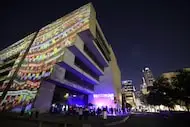 Community members interact with art installations during Aurora in downtown Dallas, TX, on...