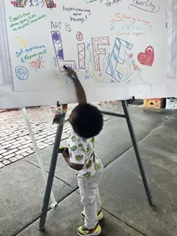 A child contributes at a Public Market feedback session. - PHOTO PROVIDED.