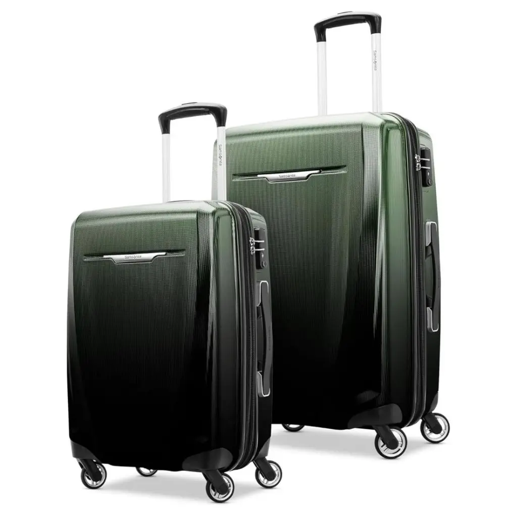 green and black hardshell luggage