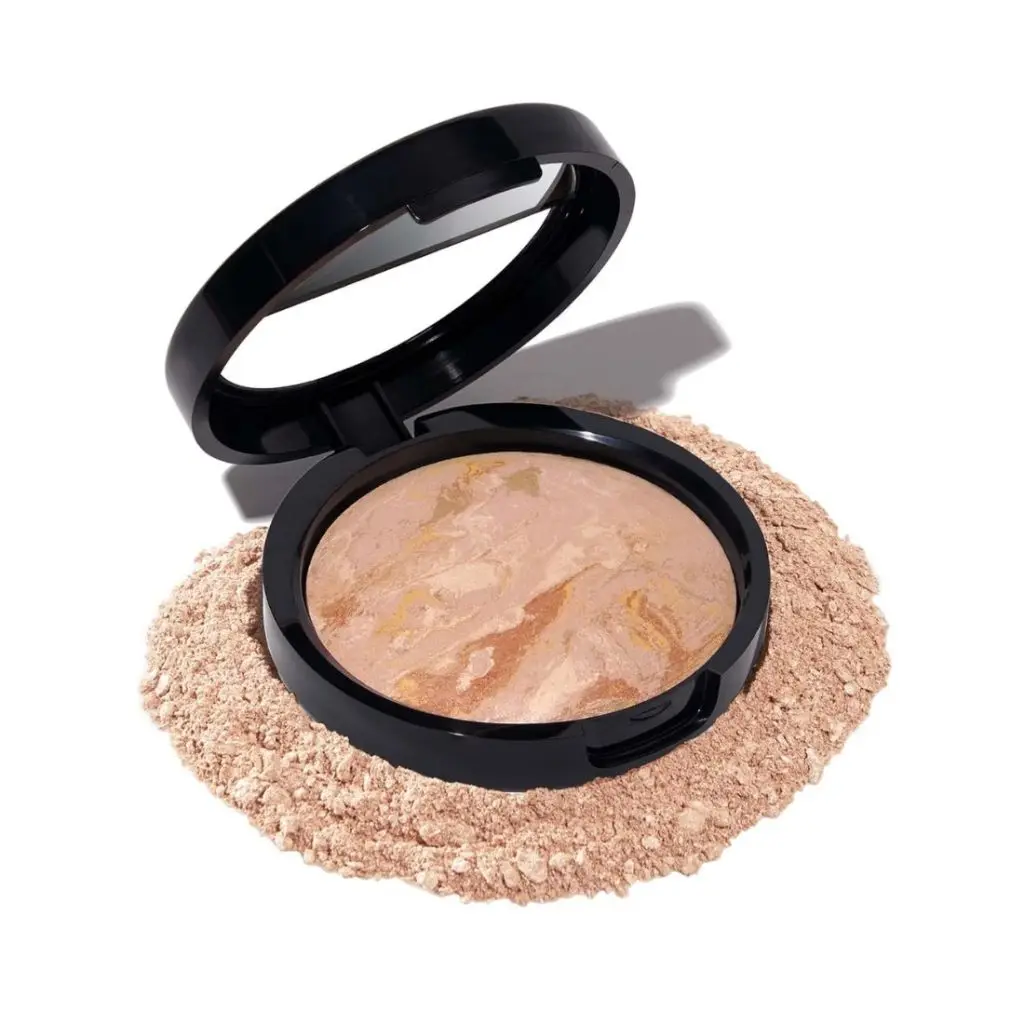 pink pressed powder in black compact