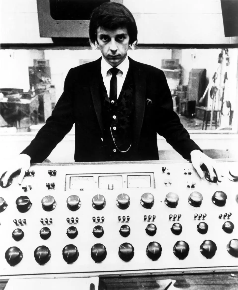 Producer Phil Spector poses at the mixing board during a recording session at Gold Star Studios in 1966 in Los Angeles.