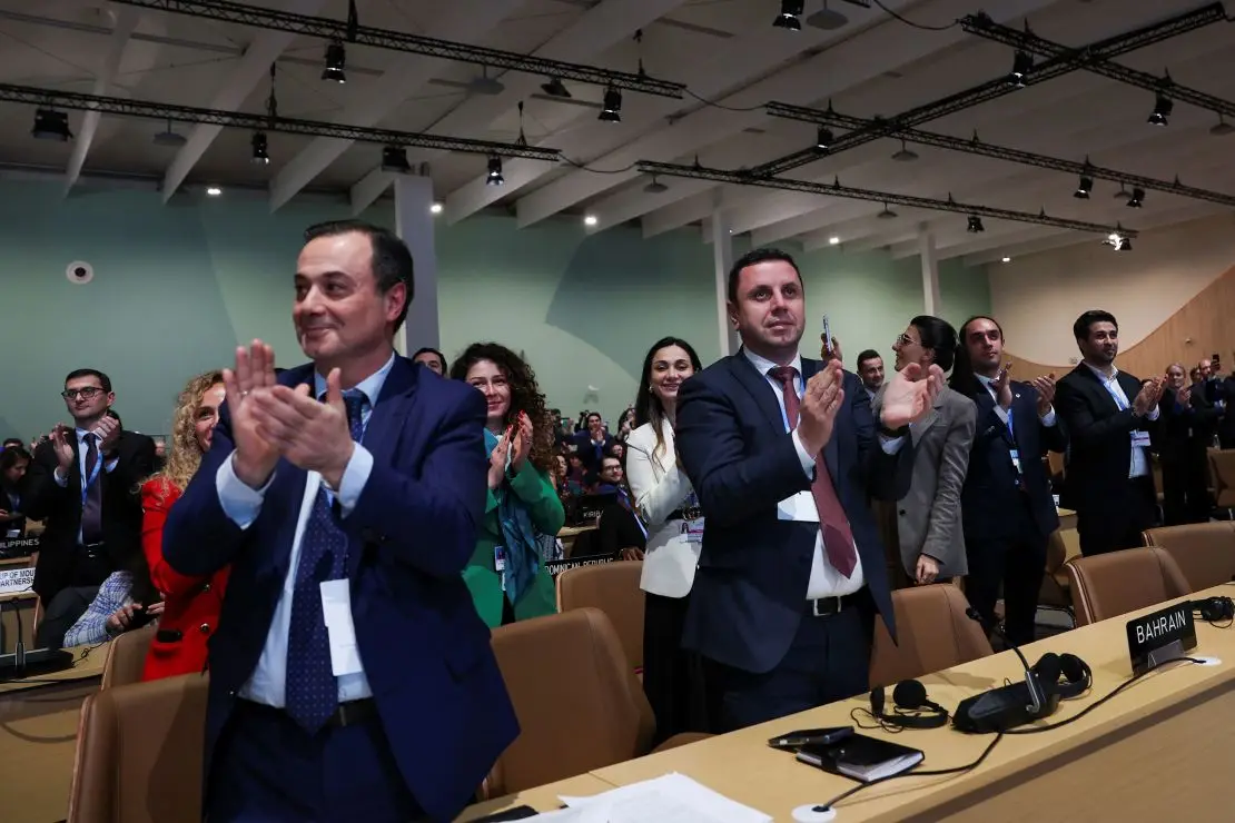 Delegates applaud during a closing plenary meeting at the COP29 United Nations Climate Change Conference, in Baku, Azerbaijan November 24, 2024. REUTERS/Murad Sezer