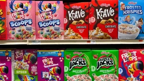 Getty Images Colourful packs of ultra-processed breakfast cereals including cartoon characters